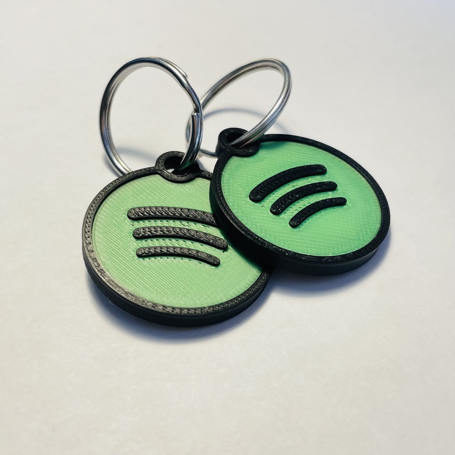 Two custom 3D-printed NFC keychains side by side